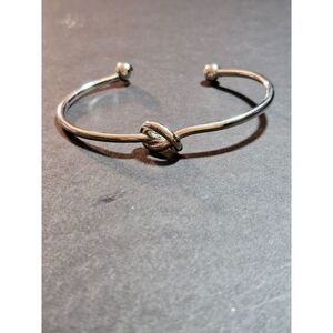 Silver tone knotted cuff bracelet 6.5"